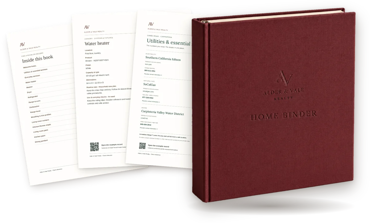 A port-wine linen Home Binder embossed for Alder & Vale Realty, with its utilities page, a water heater record and the contents page fanned out behind it